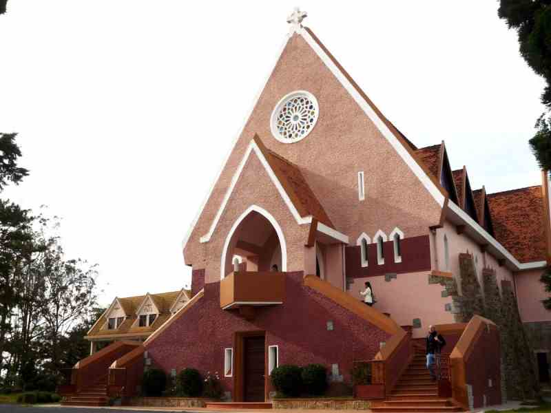 Nha Tho Domaine de Marie, a pink church on top of a hill in Da Lat